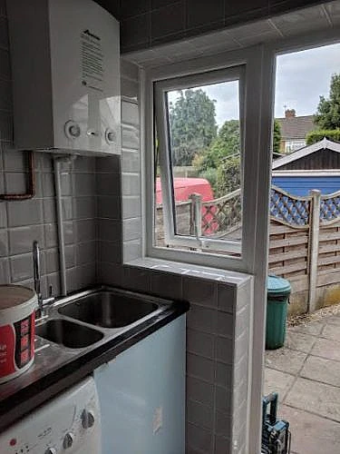 kitchen tiles next to kitchen sink