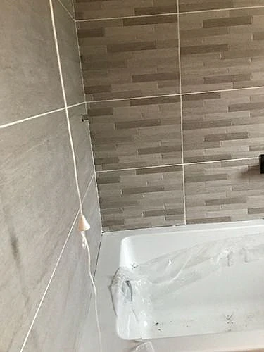 bathtub and new bathroom wall tiles 