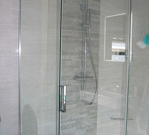 closer shot of shower and tiles 