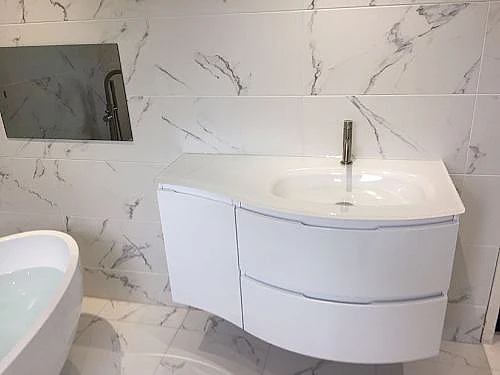 bathroom sink and white tiles